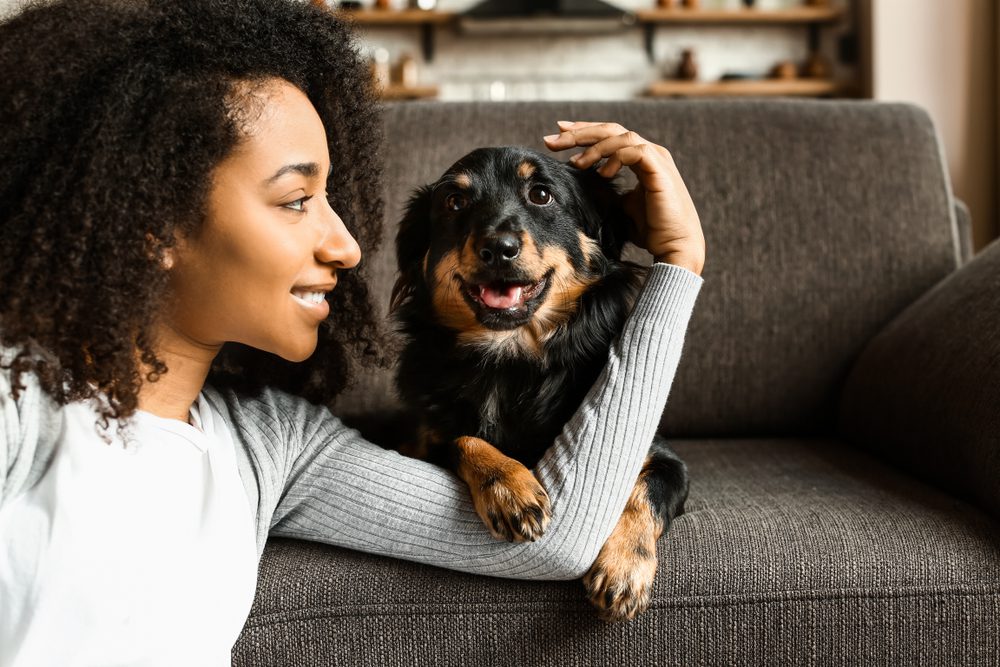 Pet owner spending quality time with her dog